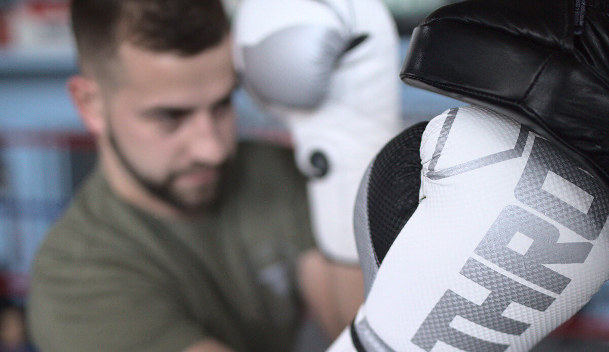 Throwdown Boxing Gloves with punch mitt pad.