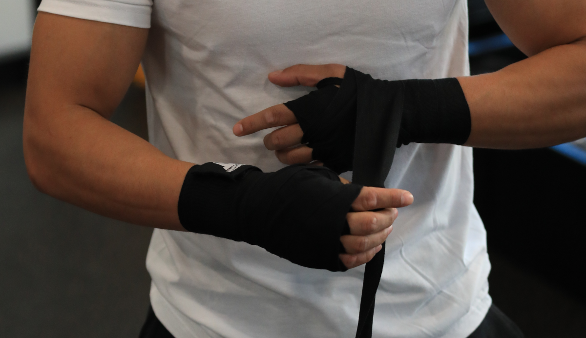 Boxing hand wraps on boxers hands.