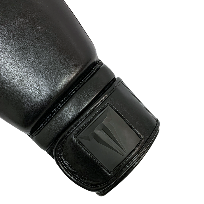 Throwdown black Stryker boxing glove. Velcro wrist strap for ease of use.