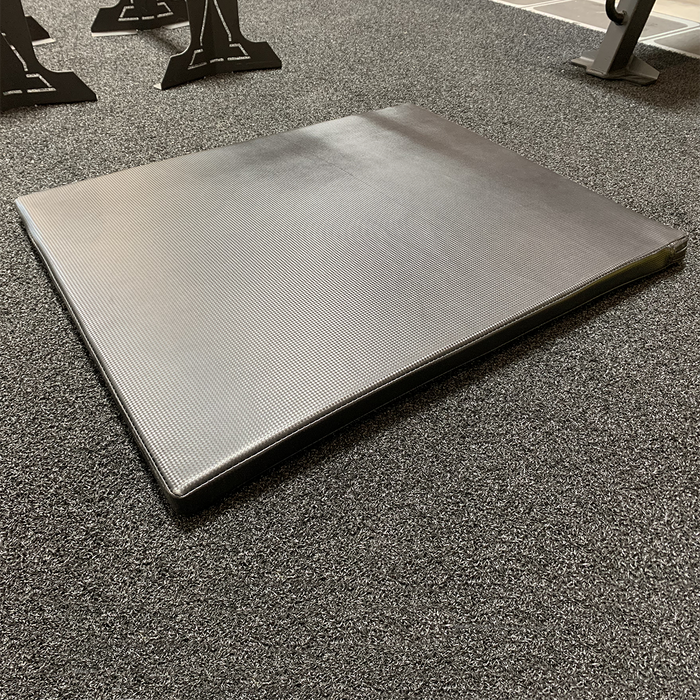 HIIT Black Workout Mat in a gym environment.