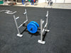 Throwdown Super Sled with two 35 lb weights mounted. On padded gym floor.