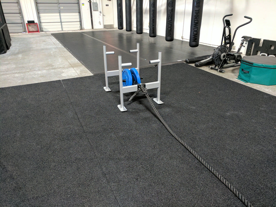 Throwdown Super Sled with two 35 lb weights mounted. Battle rope attached to front ring.