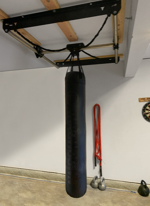 Throwdown 6 ft heavy bag hung on a support ceiling frame.